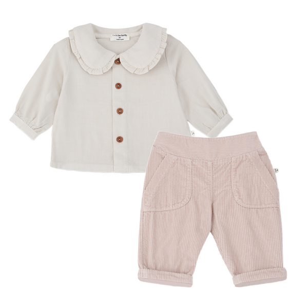 A baby clothing set featuring a cream-colored long-sleeve top with a ruffled Peter Pan collar and brown buttons, paired with light pink corduroy pants with front patch pockets and rolled cuffs