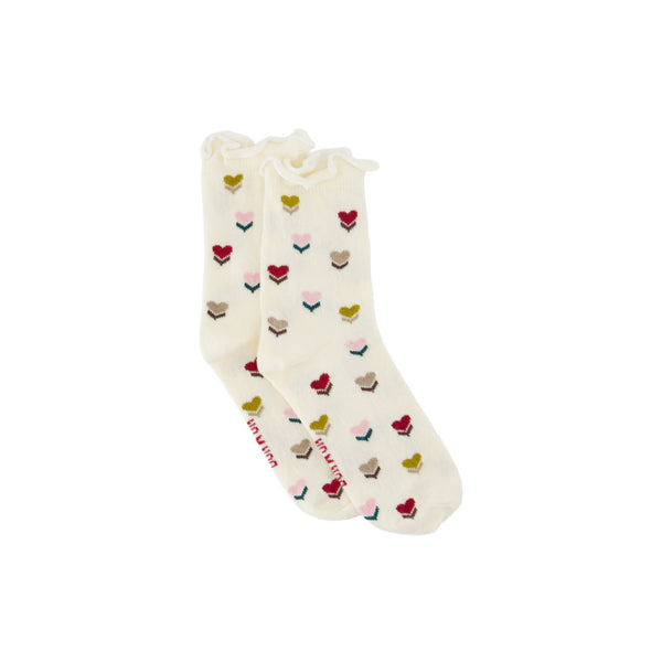 A pair of off-white ruffled socks with a repeating pattern of small embroidered flowers in red, pink, yellow, and beige,