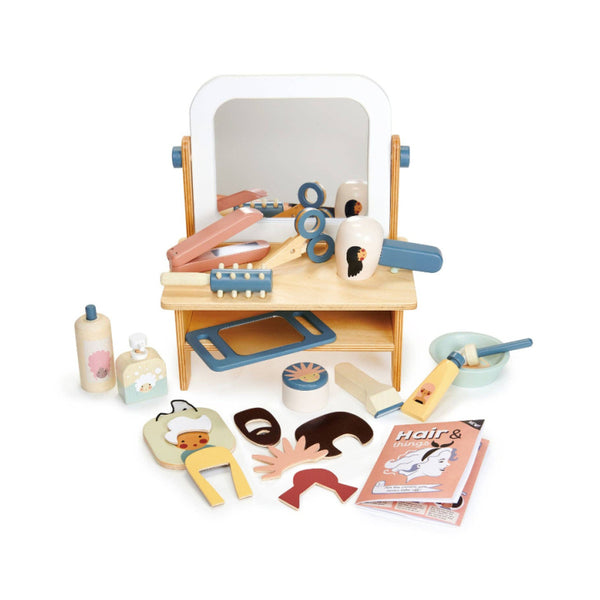 Wooden toy hair salon set with mirror, chairs, and various tools