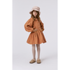 young girl modeling molo ribbed tights in soft mushroom