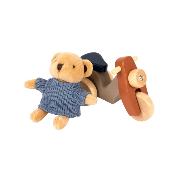 Plush teddy bear in a blue sweater with a wooden toy car