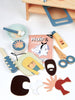 Wooden toy hair salon set with mirror, chairs, and various tools 