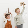 Two children playing with wooden toys 