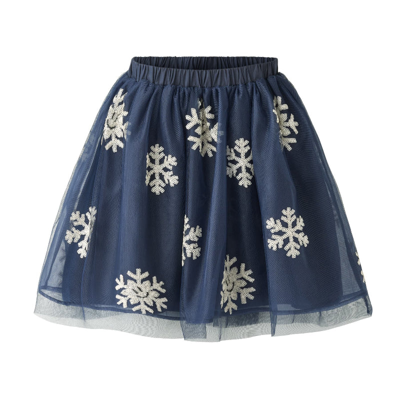 A navy blue tulle skirt with white embroidered snowflakes, featuring an elastic waistband and a layered tulle hem.