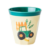 Children's cup with a green tractor design on a white background