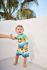 molo newton baby swimshorts palm spray