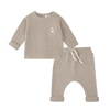 A two-piece baby outfit set in a heathered oatmeal beige fabric, featuring a long-sleeve top with a chest pocket and matching pants with a drawstring waist