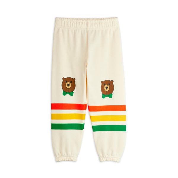 Cream-colored pants with bear illustrations and colorful stripes 