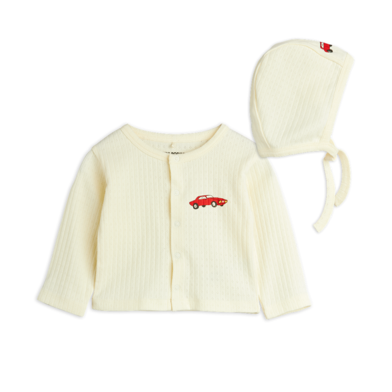 A baby knit clothing set featuring a cream ribbed cardigan and matching bonnet, both with a small red car embroidery on the front,