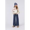 young girl modeling the molo adina pants in blue vintage