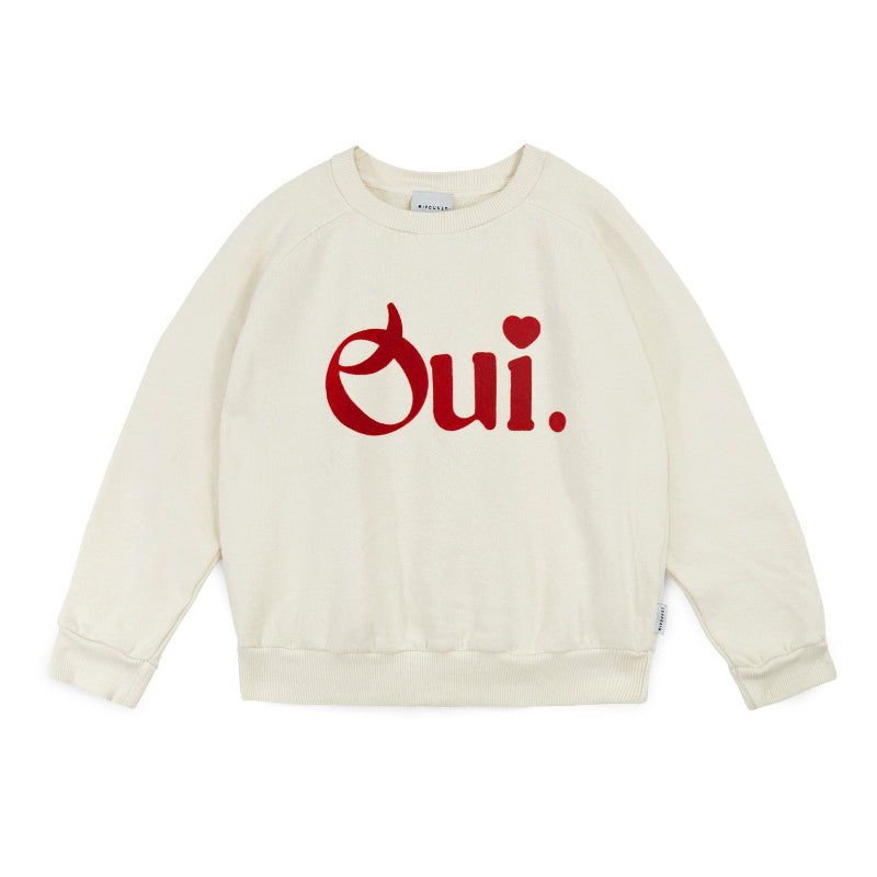 Beige sweatshirt with 'Oui' printed in red 