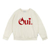 Beige sweatshirt with 'Oui' printed in red 