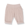 A pair of light pink corduroy pants for toddlers, shown from the back with a wide elastic waistband and two large patch pockets