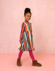 Young girl wearing a colorful striped dress by oilily
