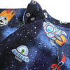 Children's clothing with space-themed design featuring rockets and UFOs on a dark blue fabric.