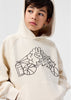 Child wearing a beige hoodie with a graphic design 
