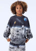 Child wearing a sweatshirt with space-themed design