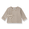 A baby long-sleeve knit cardigan in a light taupe-beige color, featuring a cream-colored drawstring bow at the front, two decorative buttons, and rolled cuffs