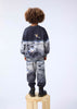 Child wearing a space-themed outfit by molo