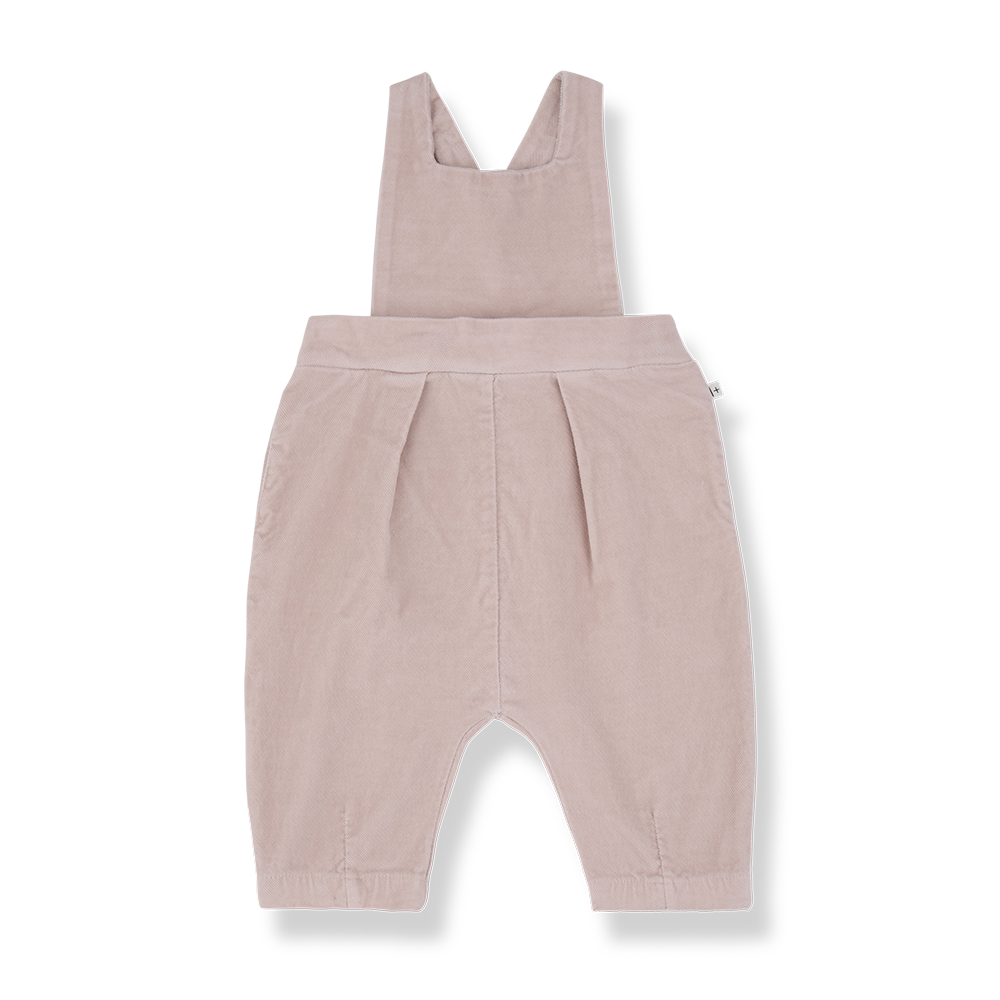 A baby's corduroy overall romper in a dusty rose pink color