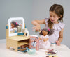 Wooden toy hair salon set with mirror, chairs, and various tools 