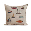 Decorative pillow with boat patterns on a wooden surface and beige background