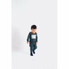 child wearing wolf & rita artur baby onesie in postcard, baby onesies autumn winter 2021 collection free shipping kodomo boston