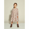 girl wearing kids on the moon long sleeve flower print dress in shades of pink.