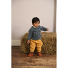 child wearing tia cibani hand knit bobble baby pullover levi mix
